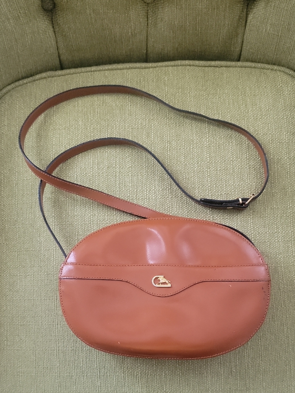 Cristian Oval Leather Crossbody Bag in Brown by